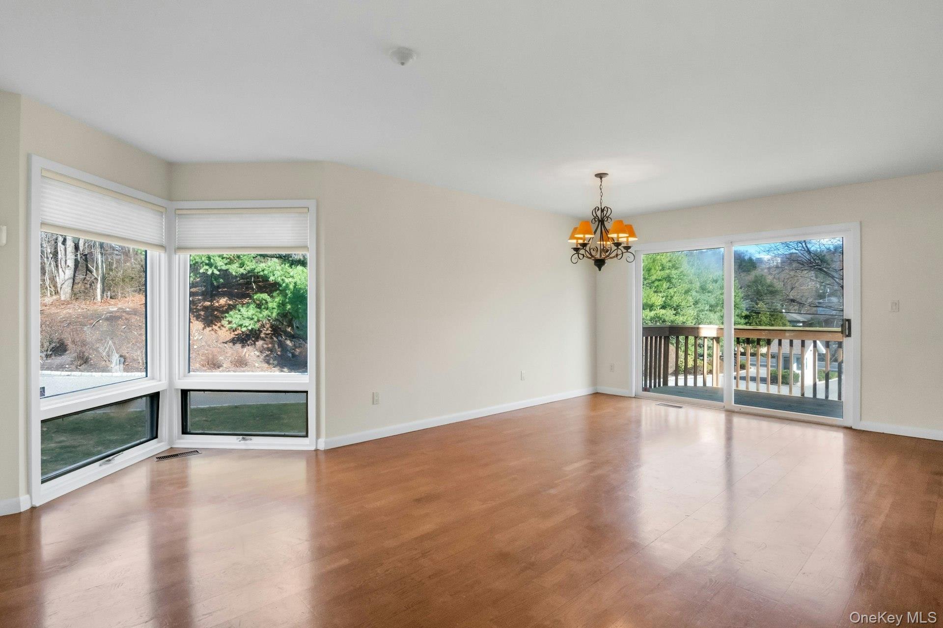 1 Spring Pond Drive, Unit 1 Ossining, NY 10562 - Photo 12 of 34 wooden floor in an empty room with a window