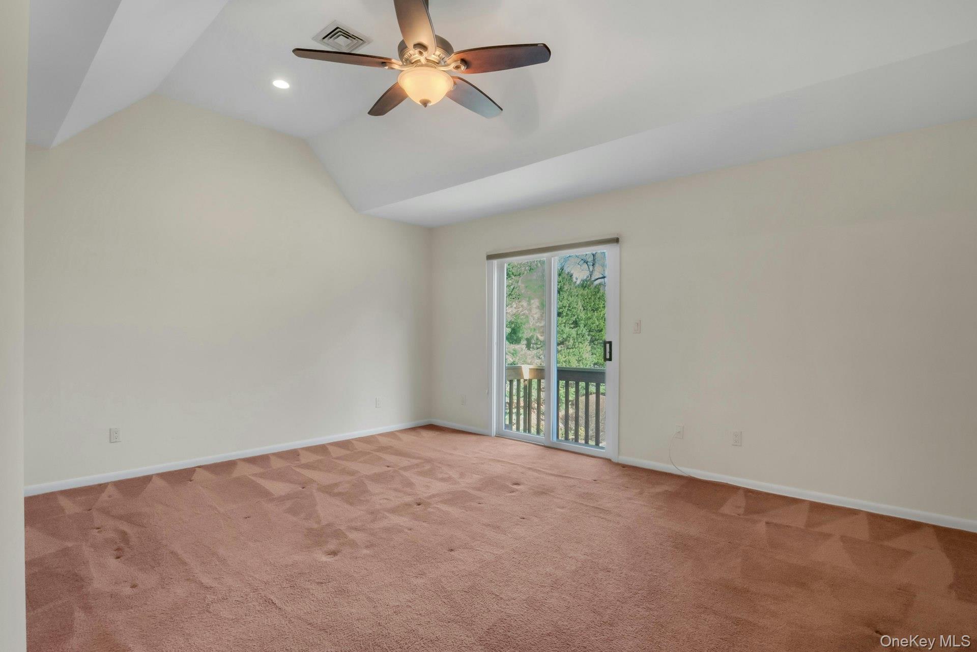 1 Spring Pond Drive, Unit 1 Ossining, NY 10562 - Photo 18 of 34 an empty room with a window and a fan
