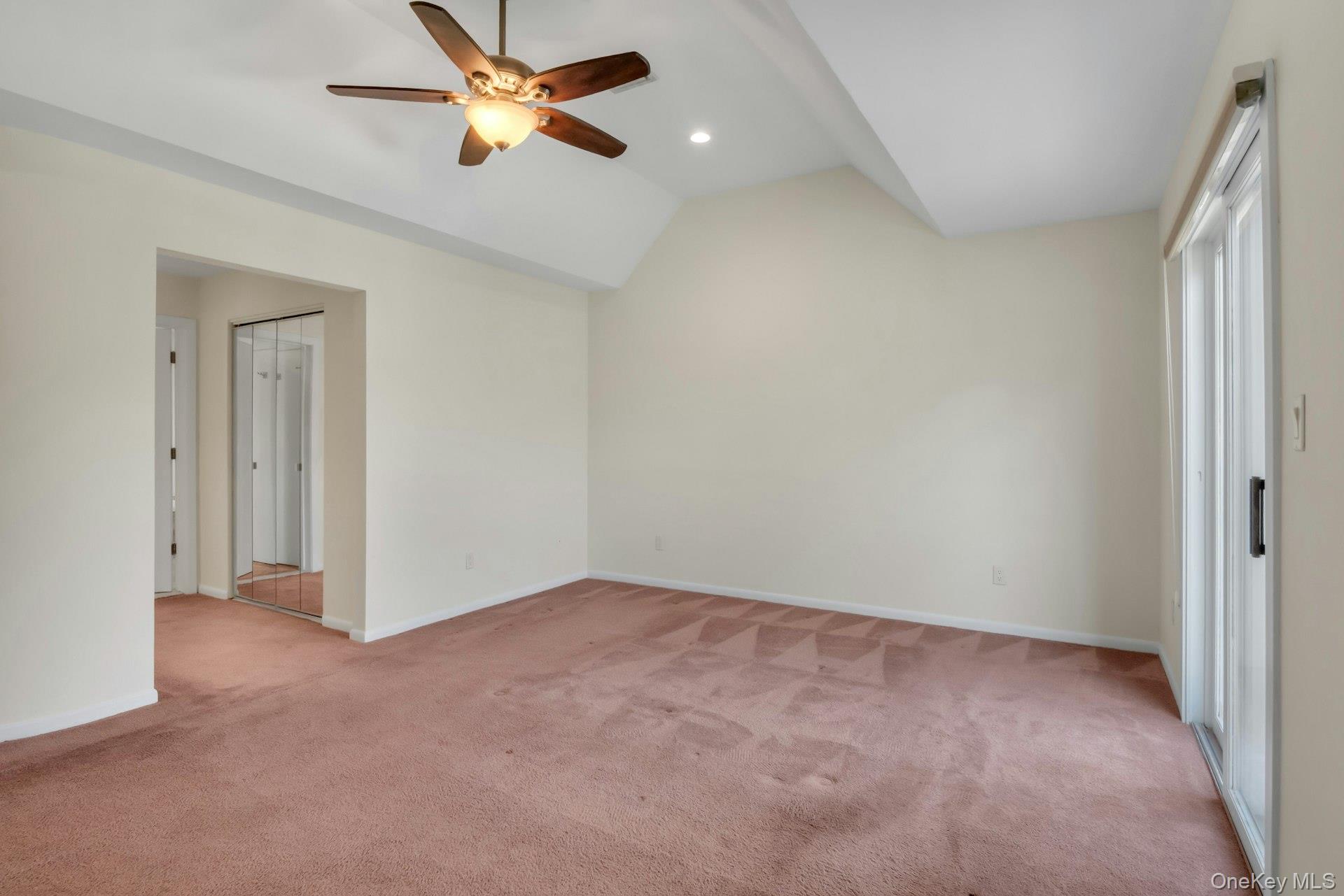 1 Spring Pond Drive, Unit 1 Ossining, NY 10562 - Photo 19 of 34 an empty room with closet and a chandelier fan