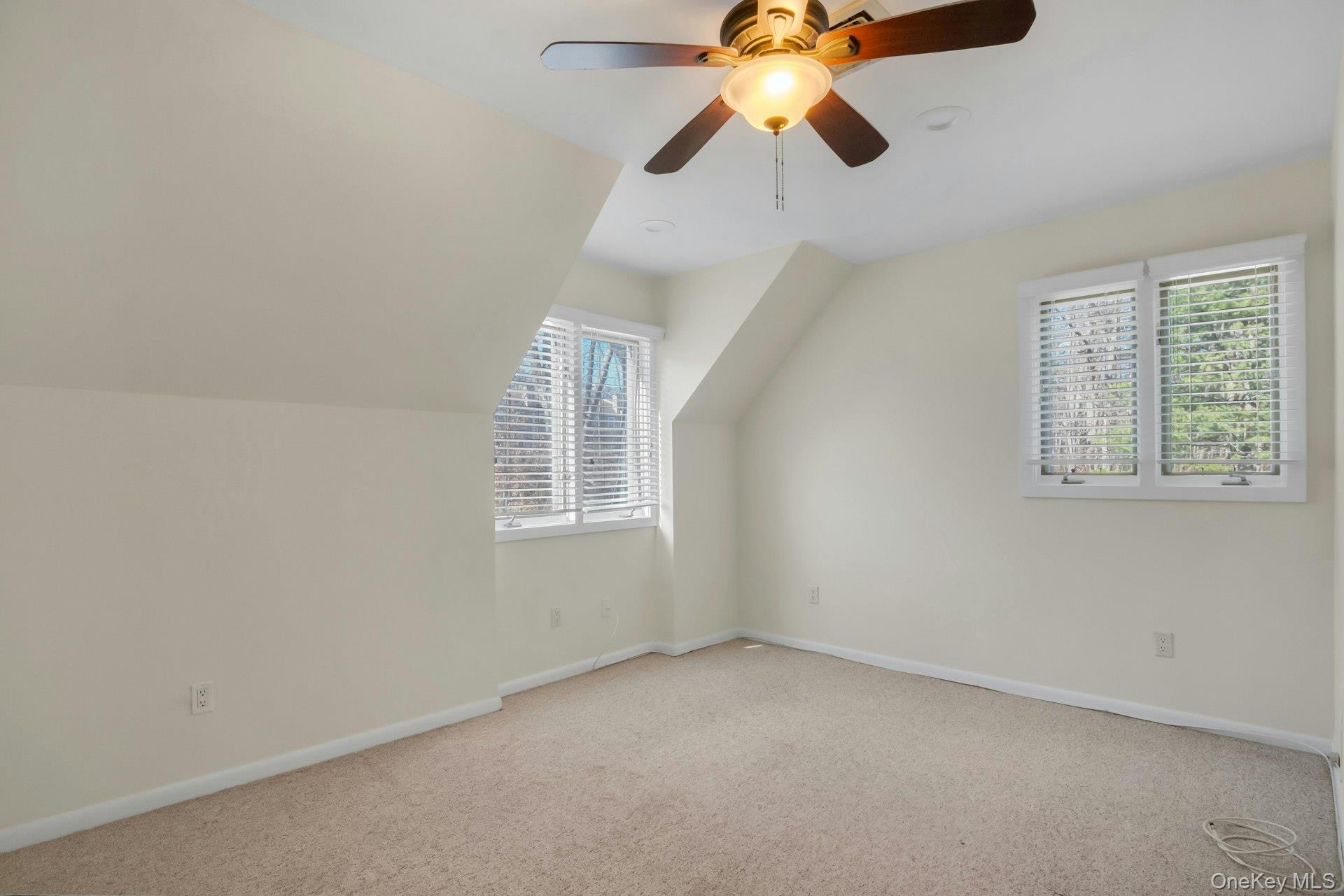1 Spring Pond Drive, Unit 1 Ossining, NY 10562 - Photo 25 of 34 an empty room with windows and fan