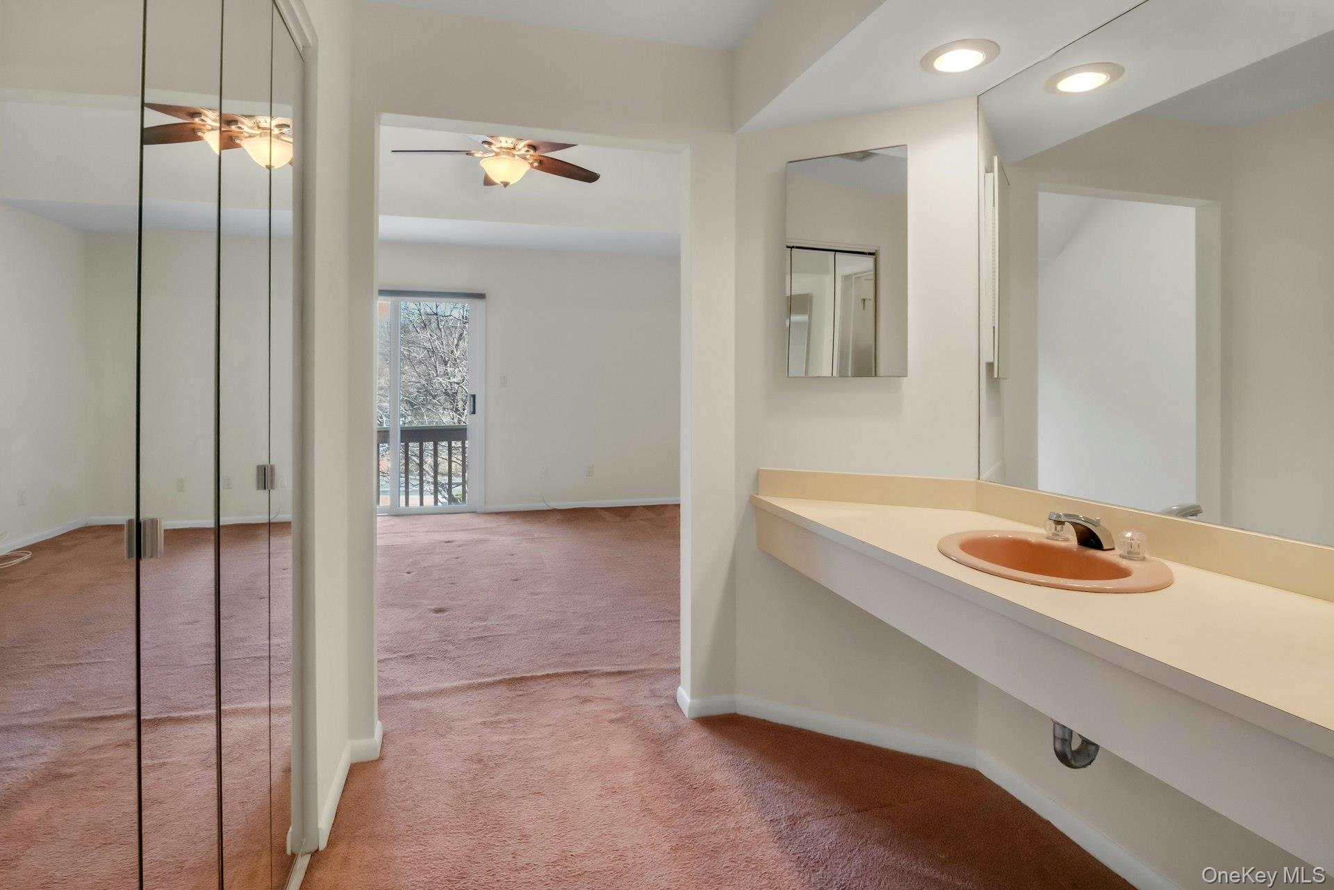 1 Spring Pond Drive, Unit 1 Ossining, NY 10562 - Photo 26 of 34 a bathroom with a sink and a mirror