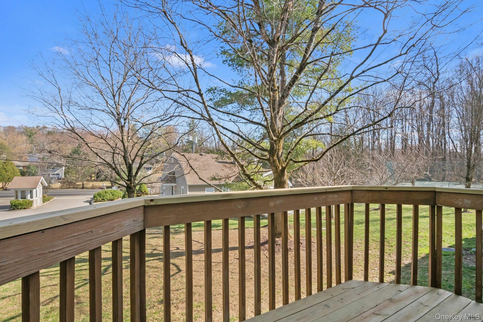 1 Spring Pond Drive, Unit 1 Ossining, NY 10562 - Photo 29 of 34 a view of roof deck with wooden fence and floor