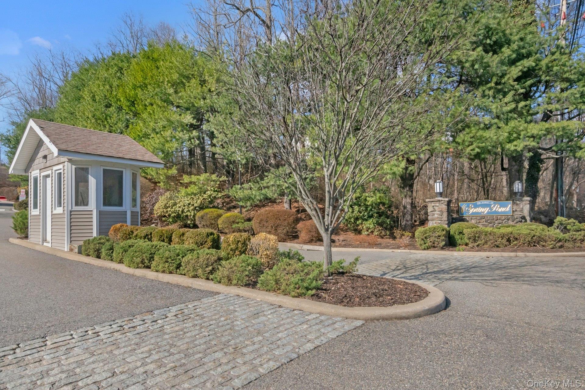 1 Spring Pond Drive, Unit 1 Ossining, NY 10562 - Photo 32 of 34 a backyard of a house with a garden and barbeque oven