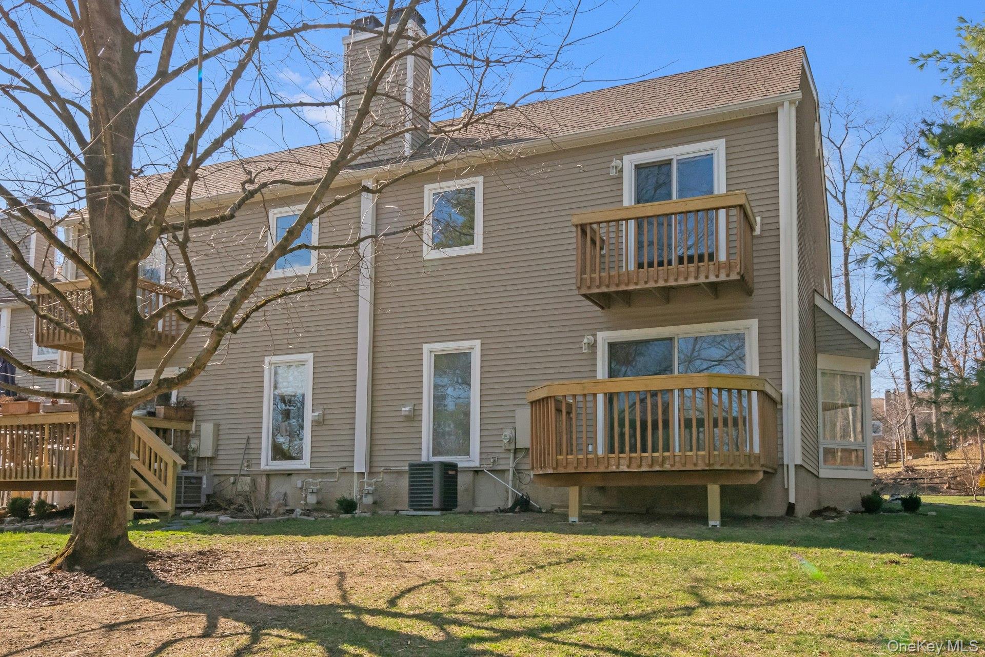 1 Spring Pond Drive, Unit 1 Ossining, NY 10562 - Photo 4 of 34 a view of house with yard in front of it