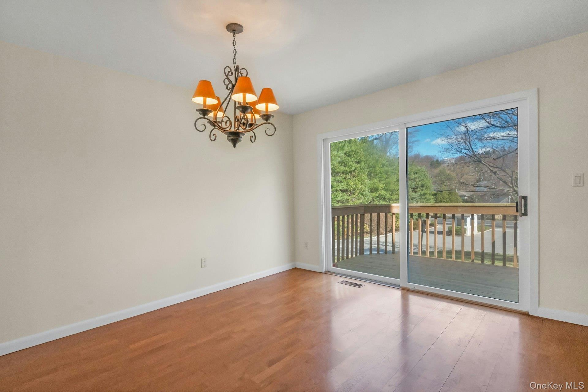 1 Spring Pond Drive, Unit 1 Ossining, NY 10562 - Photo 10 of 34 a view of a room with wooden floor chandelier and window
