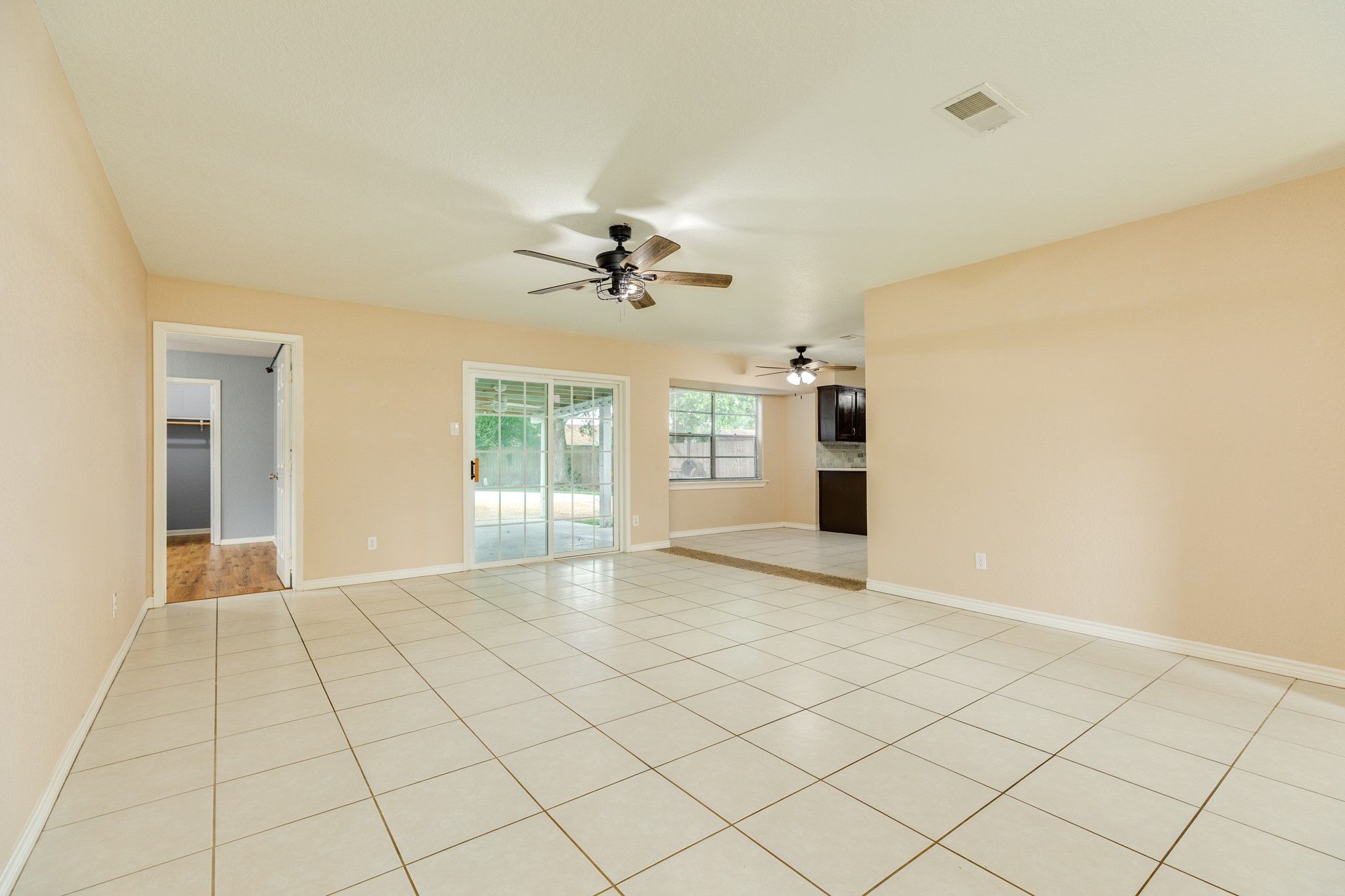 128 Houston Street Angleton, TX 77515 - Photo 13 of 25 a view of an empty room with a window