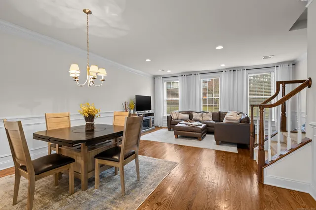 a view of a dining room with furniture window and wooden floor