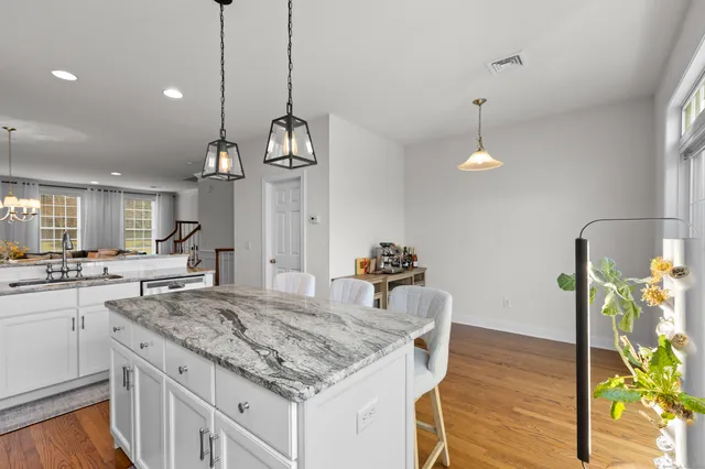 a kitchen with sink and refrigerator