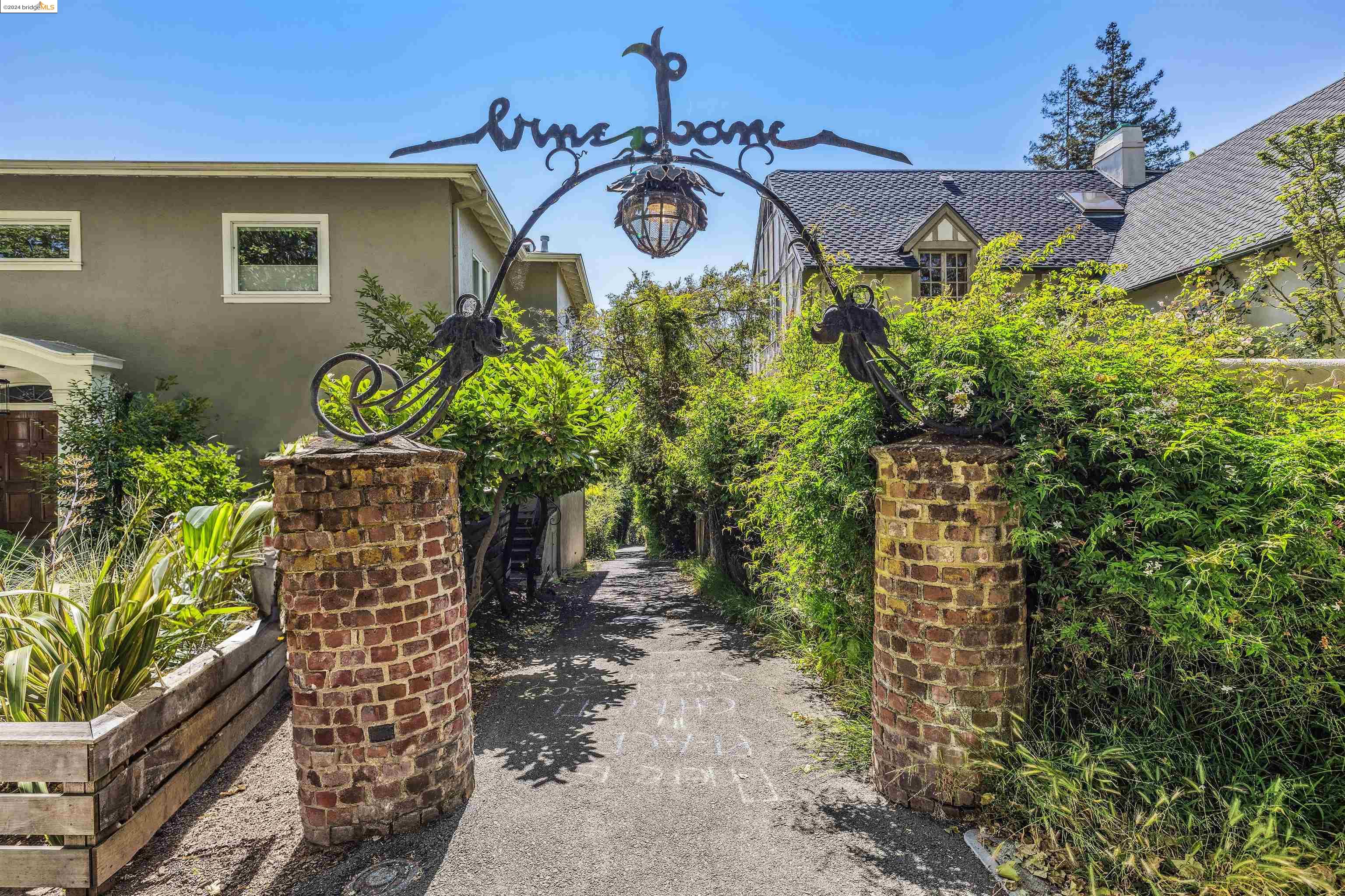 2 Vine Lane Berkeley, CA 94708 - Photo 1 of 1 a front view of a house with lots of green space