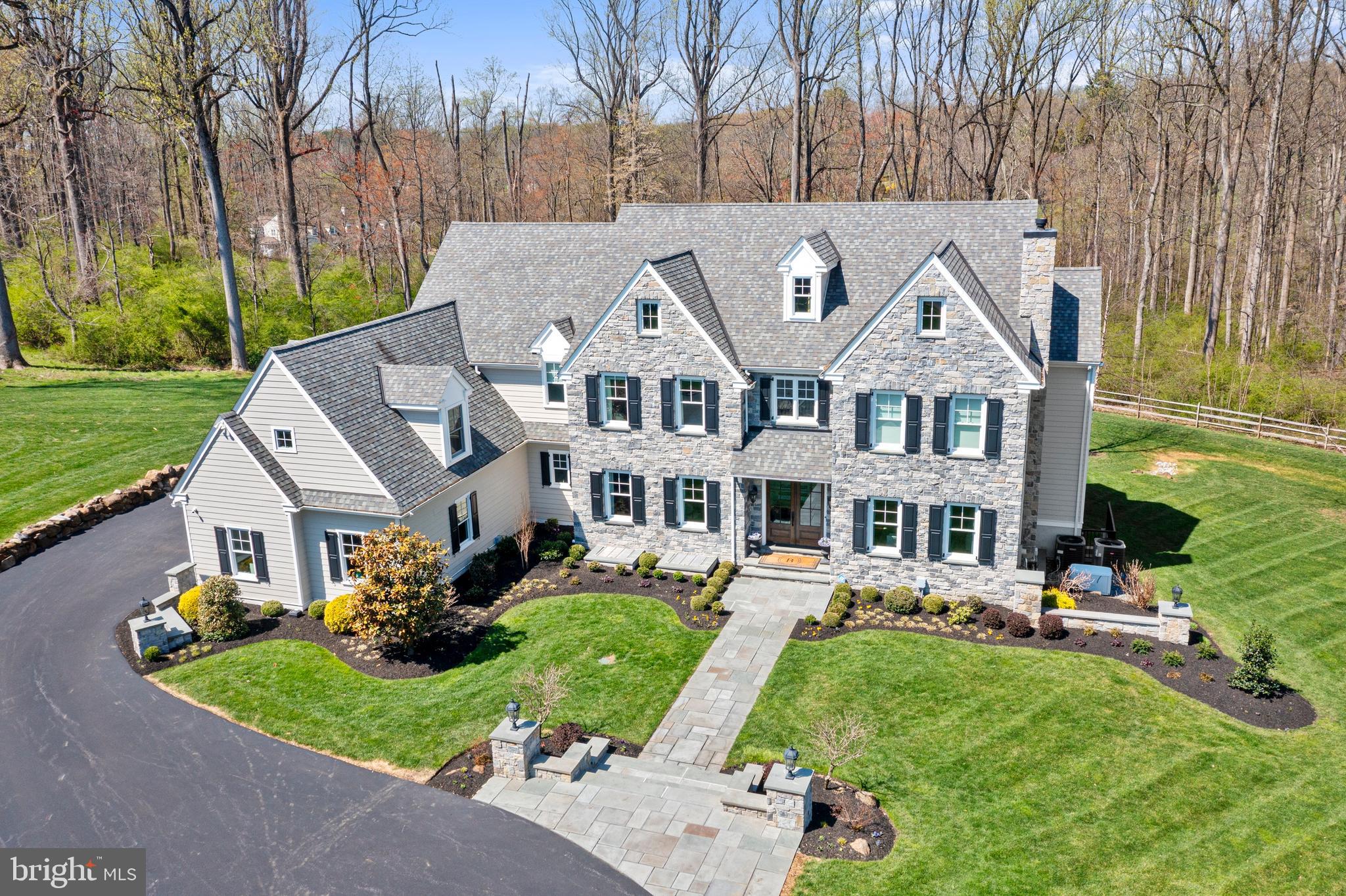 a front view of a house with a yard table and chairs