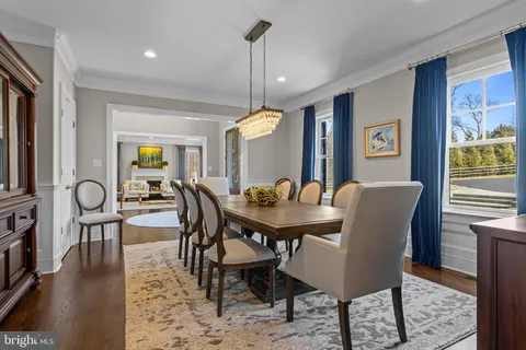 a large kitchen with white cabinets and stainless steel appliances
