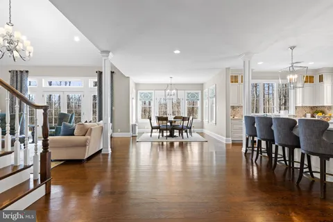 a living room with furniture wooden floor and a fireplace