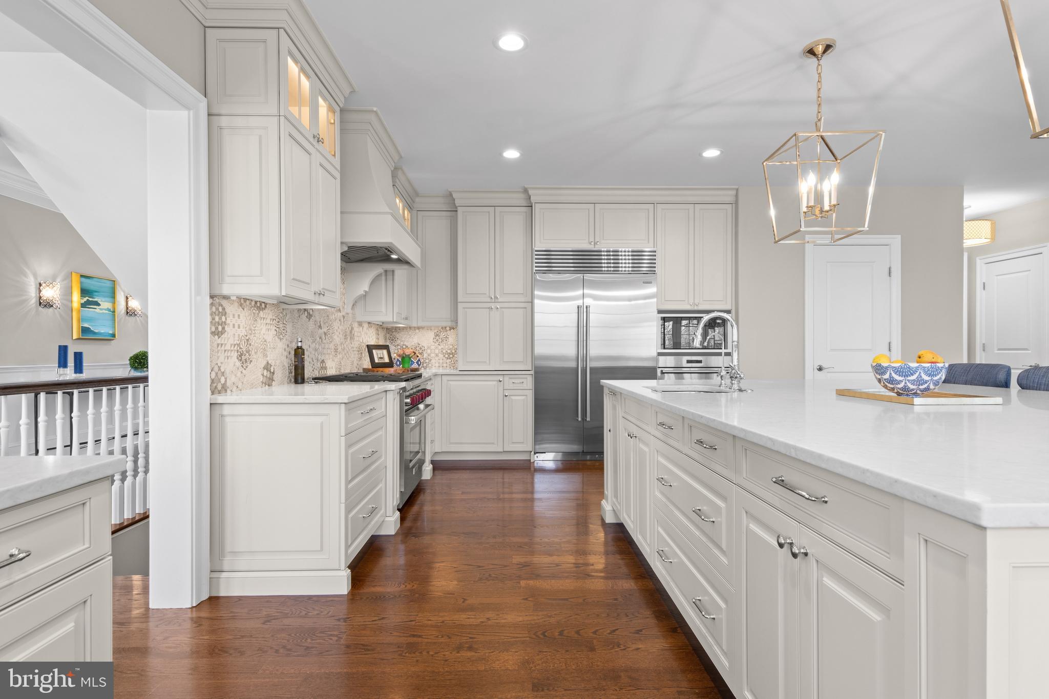2207 White Horse Road Berwyn, PA 19312 - Photo 19 of 69 a large kitchen with white cabinets and stainless steel appliances