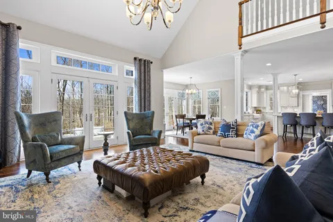 a view of entryway with wooden floor and stairs