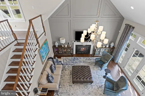 a spacious bedroom with a bed and a flat screen tv