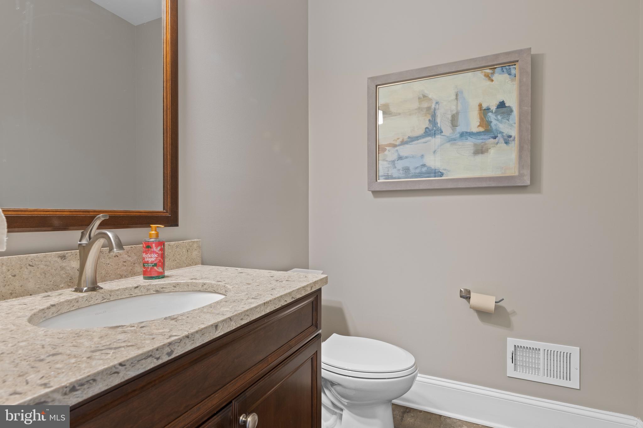 2207 White Horse Road Berwyn, PA 19312 - Photo 30 of 69 a bathroom with a granite countertop sink and a toilet