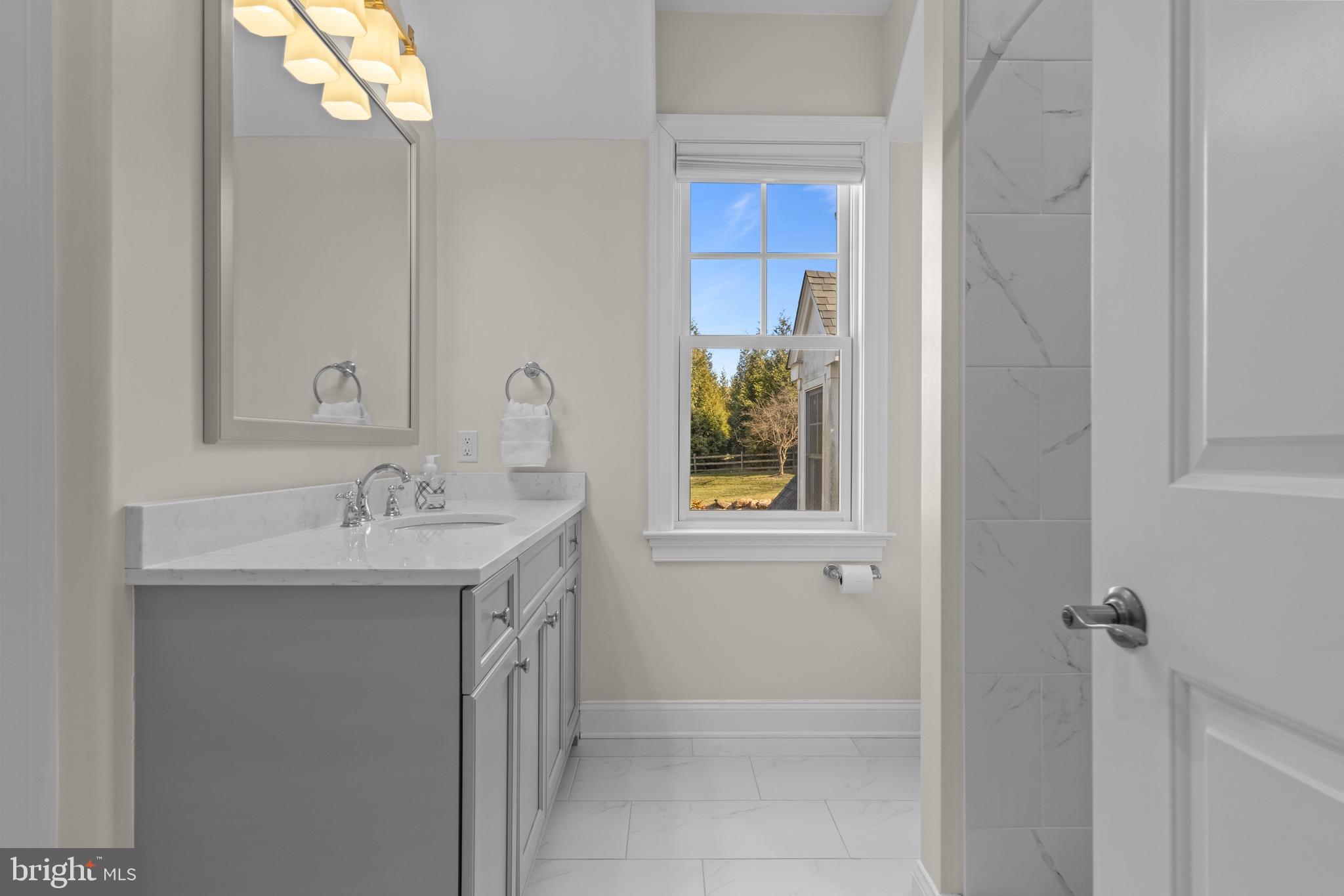 2207 White Horse Road Berwyn, PA 19312 - Photo 40 of 69 a bathroom with a sink and a window