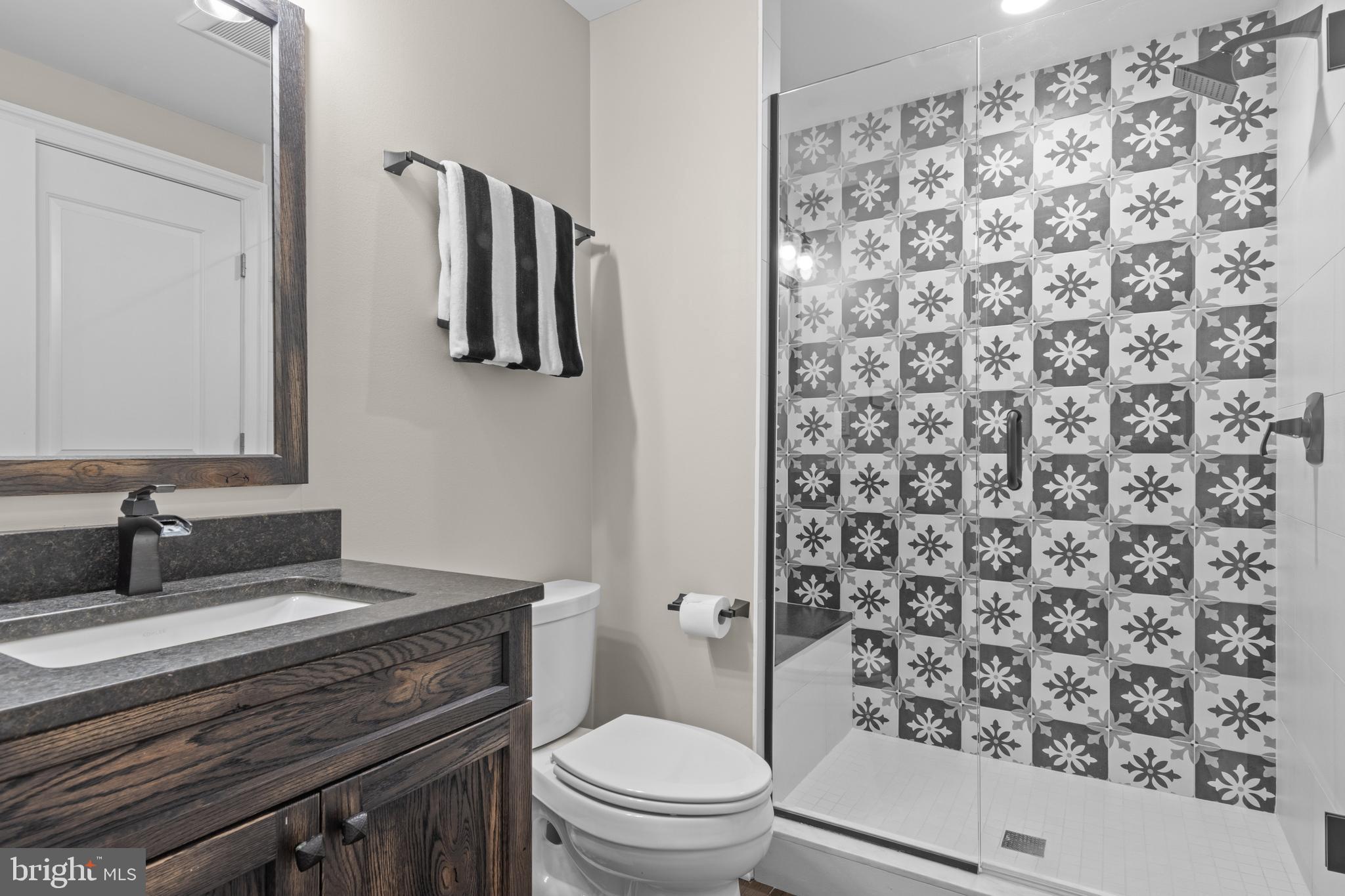 2207 White Horse Road Berwyn, PA 19312 - Photo 59 of 69 a bathroom with a granite countertop sink a toilet and a mirror