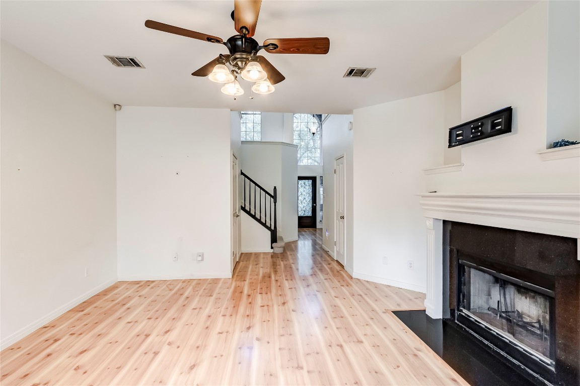 1901 Springwater Drive Round Rock, TX 78681 - Photo 12 of 36 a view of empty room with wooden floor and fireplace