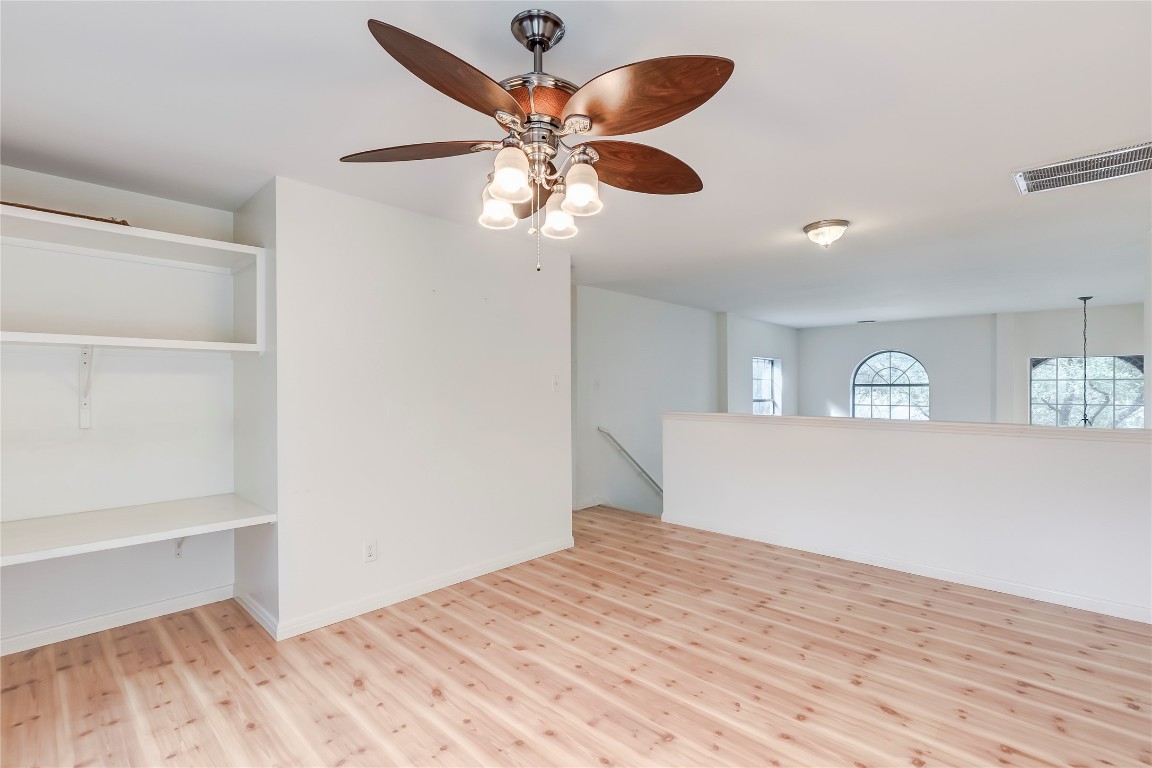 1901 Springwater Drive Round Rock, TX 78681 - Photo 19 of 36 a bedroom with a bed and a ceiling fan