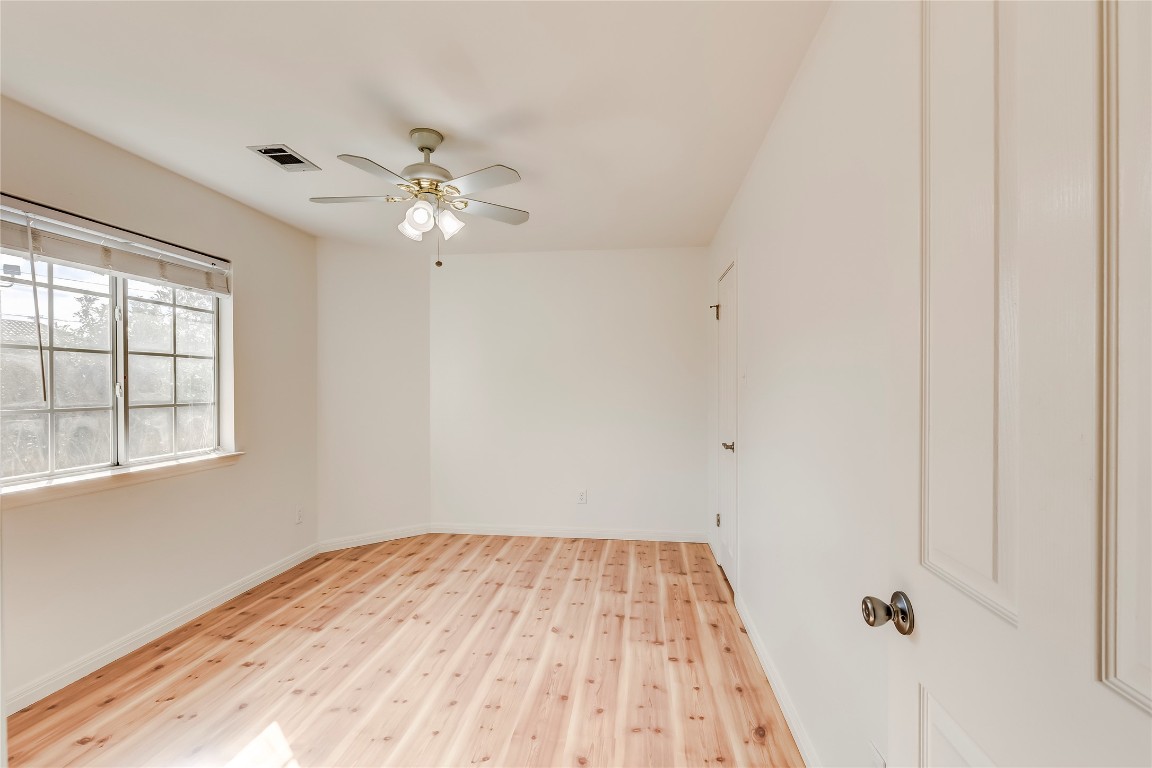 1901 Springwater Drive Round Rock, TX 78681 - Photo 29 of 36 a view of a room with a ceiling fan and a window