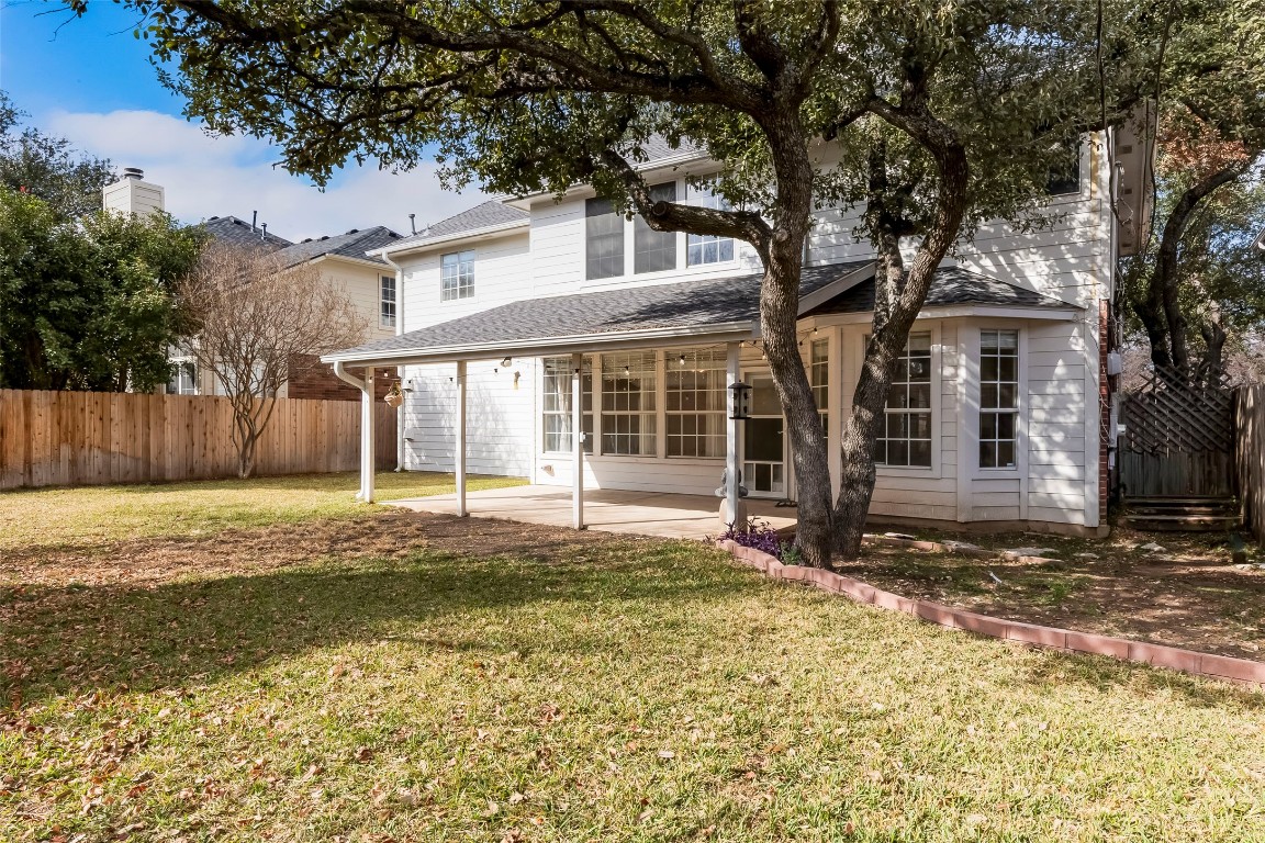 1901 Springwater Drive Round Rock, TX 78681 - Photo 33 of 36 a front view of a house with a garden and yard