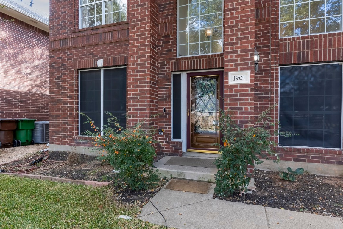 1901 Springwater Drive Round Rock, TX 78681 - Photo 4 of 36 a front view of a house having yard
