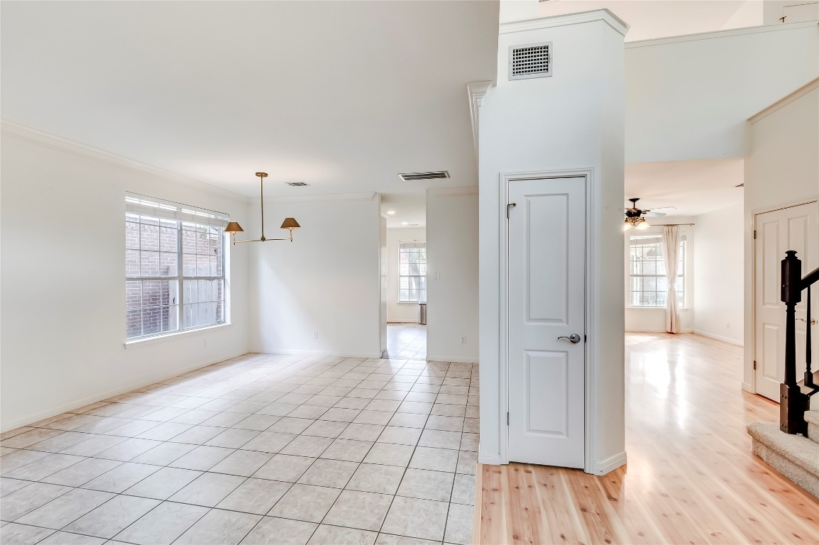 1901 Springwater Drive Round Rock, TX 78681 - Photo 6 of 36 a view of a hallway with wooden floor and a living room