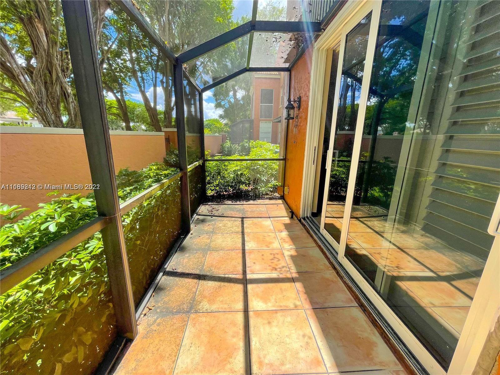3153 Clint Moore Road, Unit 106 Boca Raton, FL 33496 - Photo 18 of 38 a view of a pathway with a balcony