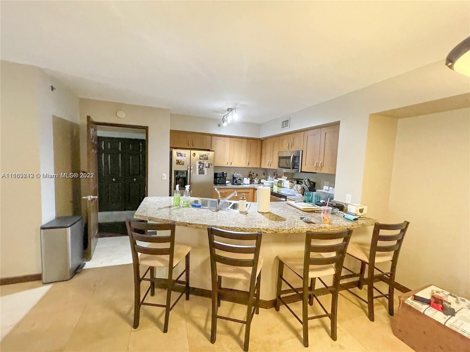 3153 Clint Moore Road, Unit 106 Boca Raton, FL 33496 - Photo 19 of 38 a dining room with furniture and a window