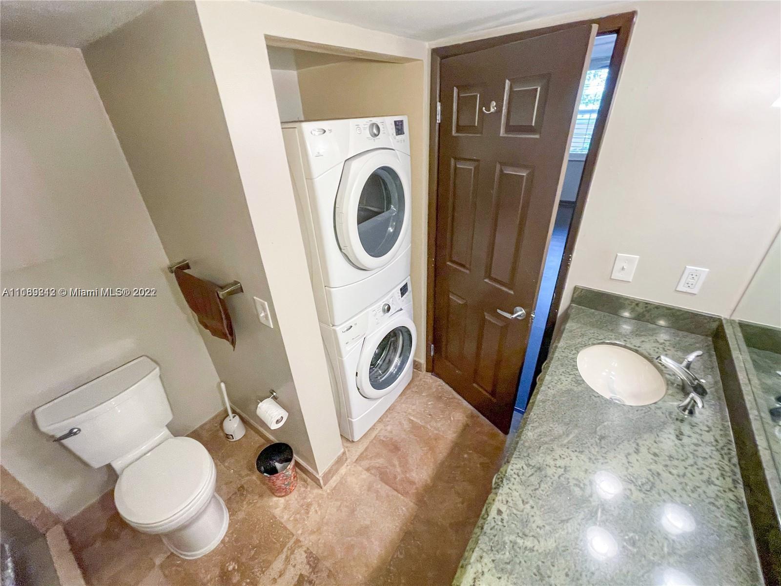 3153 Clint Moore Road, Unit 106 Boca Raton, FL 33496 - Photo 20 of 38 a bathroom with a toilet and a sink