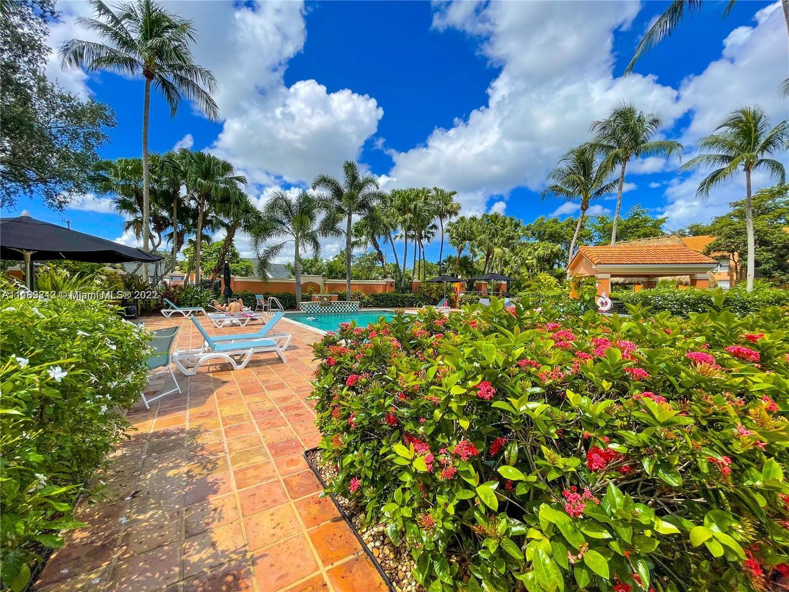 3153 Clint Moore Road, Unit 106 Boca Raton, FL 33496 - Photo 22 of 38 a view of a yard with plants