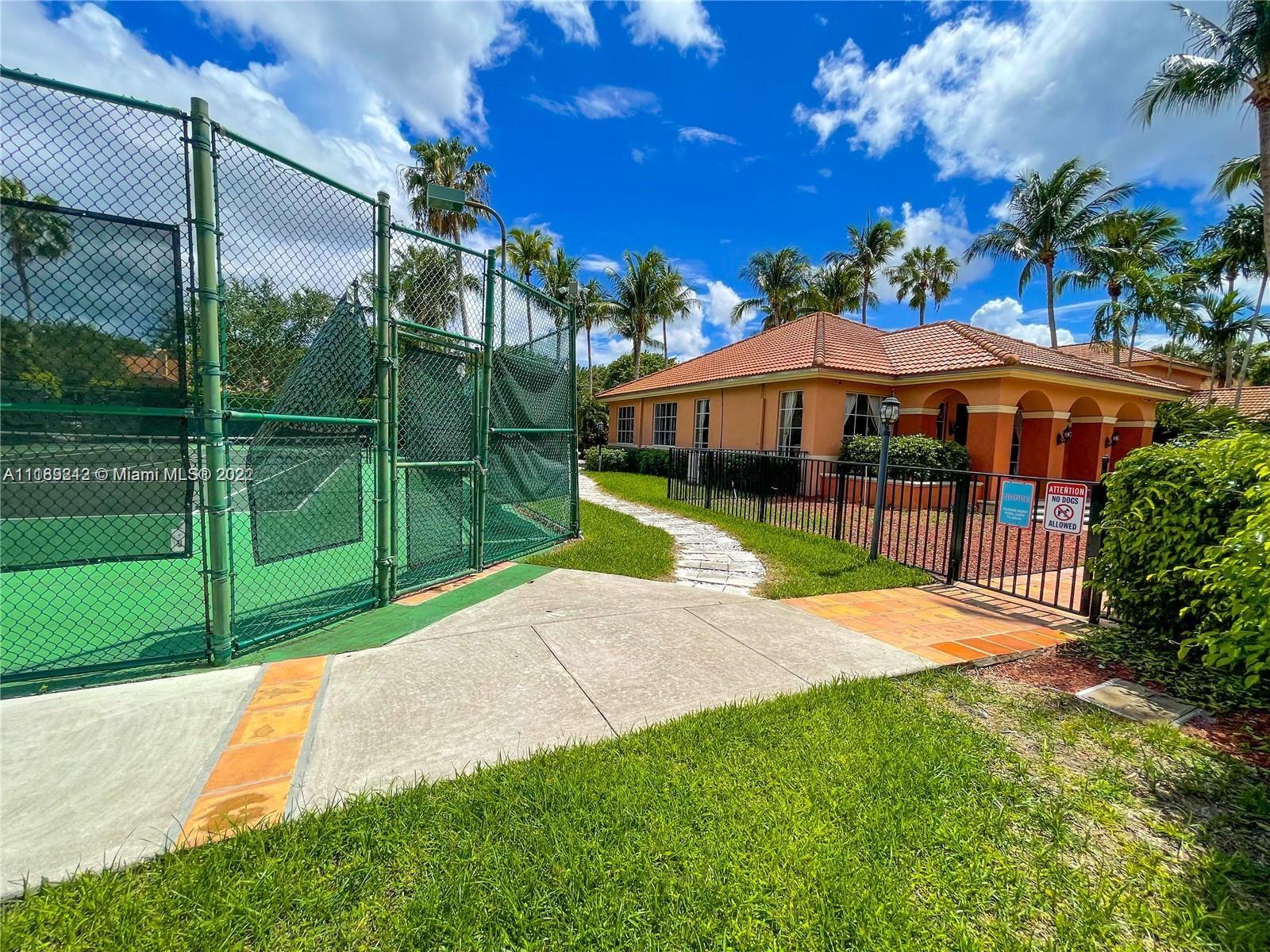 3153 Clint Moore Road, Unit 106 Boca Raton, FL 33496 - Photo 27 of 38 a view of a backyard with a garden and plants