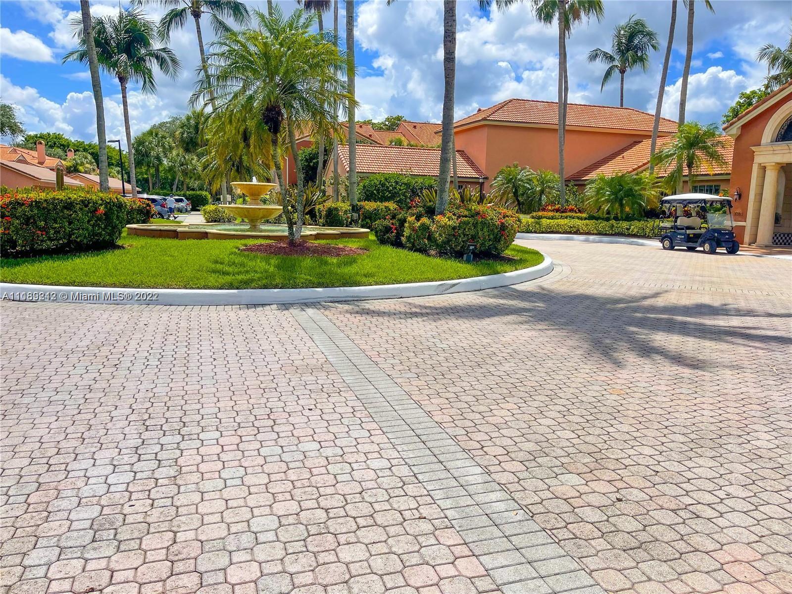 3153 Clint Moore Road, Unit 106 Boca Raton, FL 33496 - Photo 29 of 38 a view of a backyard with a garden