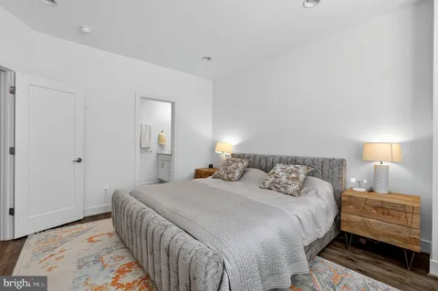 a bedroom with a bed and a lamp