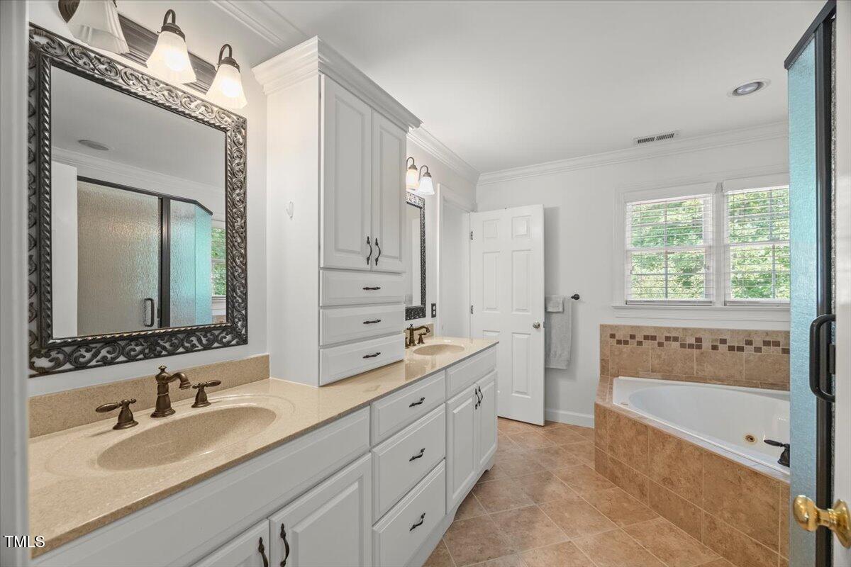 102 Barometer Lane Cary, NC 27513 - Photo 20 of 44 a bathroom with a double vanity sink mirror double and bathtub