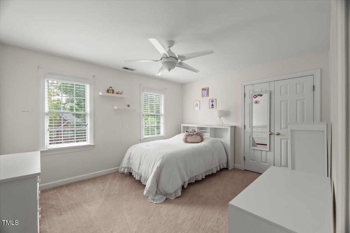 102 Barometer Lane Cary, NC 27513 - Photo 22 of 44 a bedroom with a bed and a window