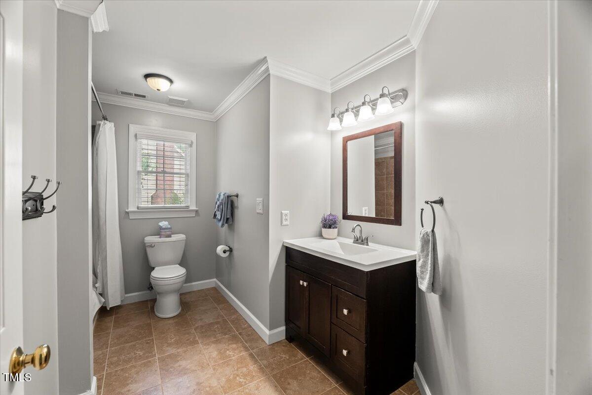 102 Barometer Lane Cary, NC 27513 - Photo 23 of 44 a spacious bathroom with a toilet sink and mirror