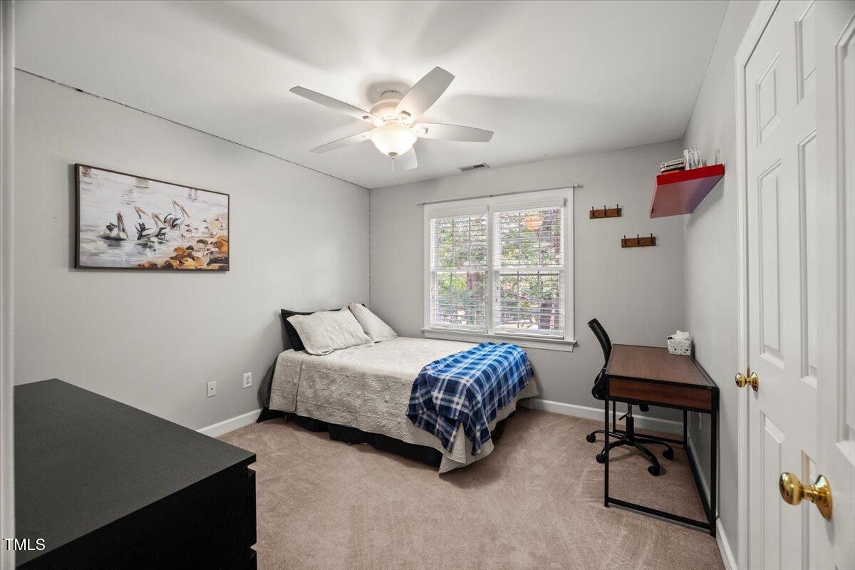 102 Barometer Lane Cary, NC 27513 - Photo 25 of 44 a bedroom with a bed and a window