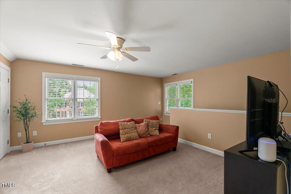 102 Barometer Lane Cary, NC 27513 - Photo 27 of 44 a living room with furniture and a flat screen tv
