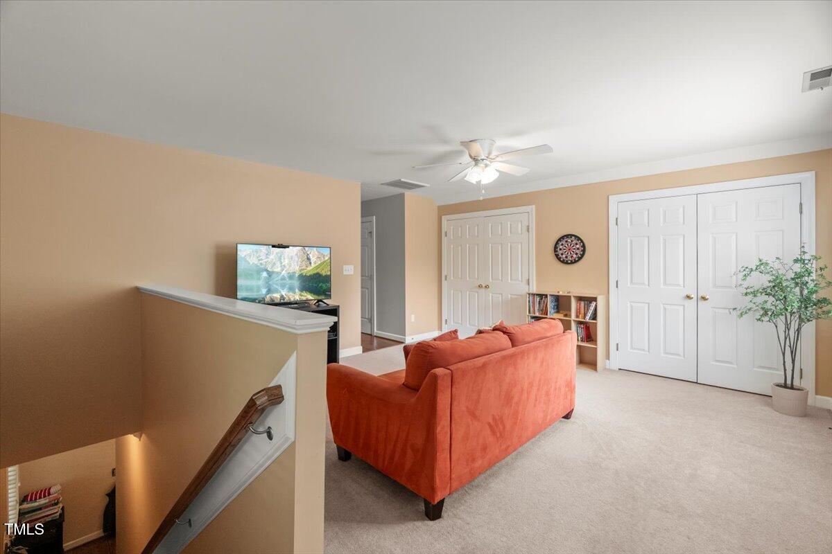 102 Barometer Lane Cary, NC 27513 - Photo 28 of 44 a living room with furniture and a potted plant