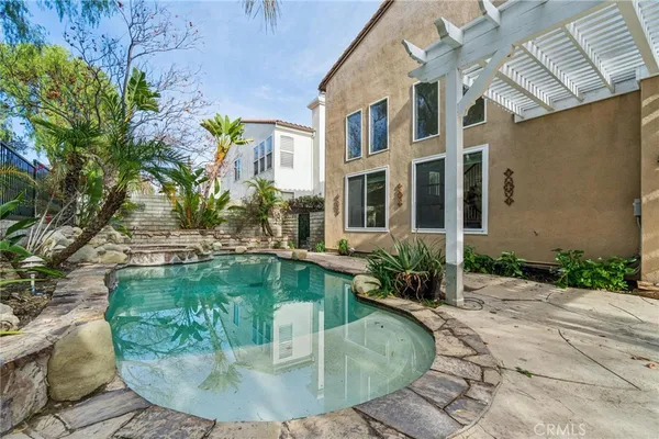 a view of a swimming pool with a sitting area