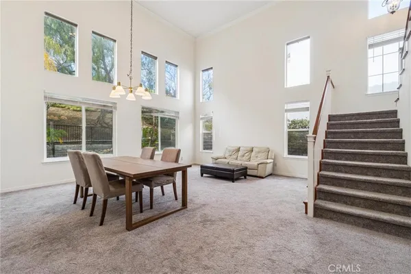 a view of a livingroom with furniture and window