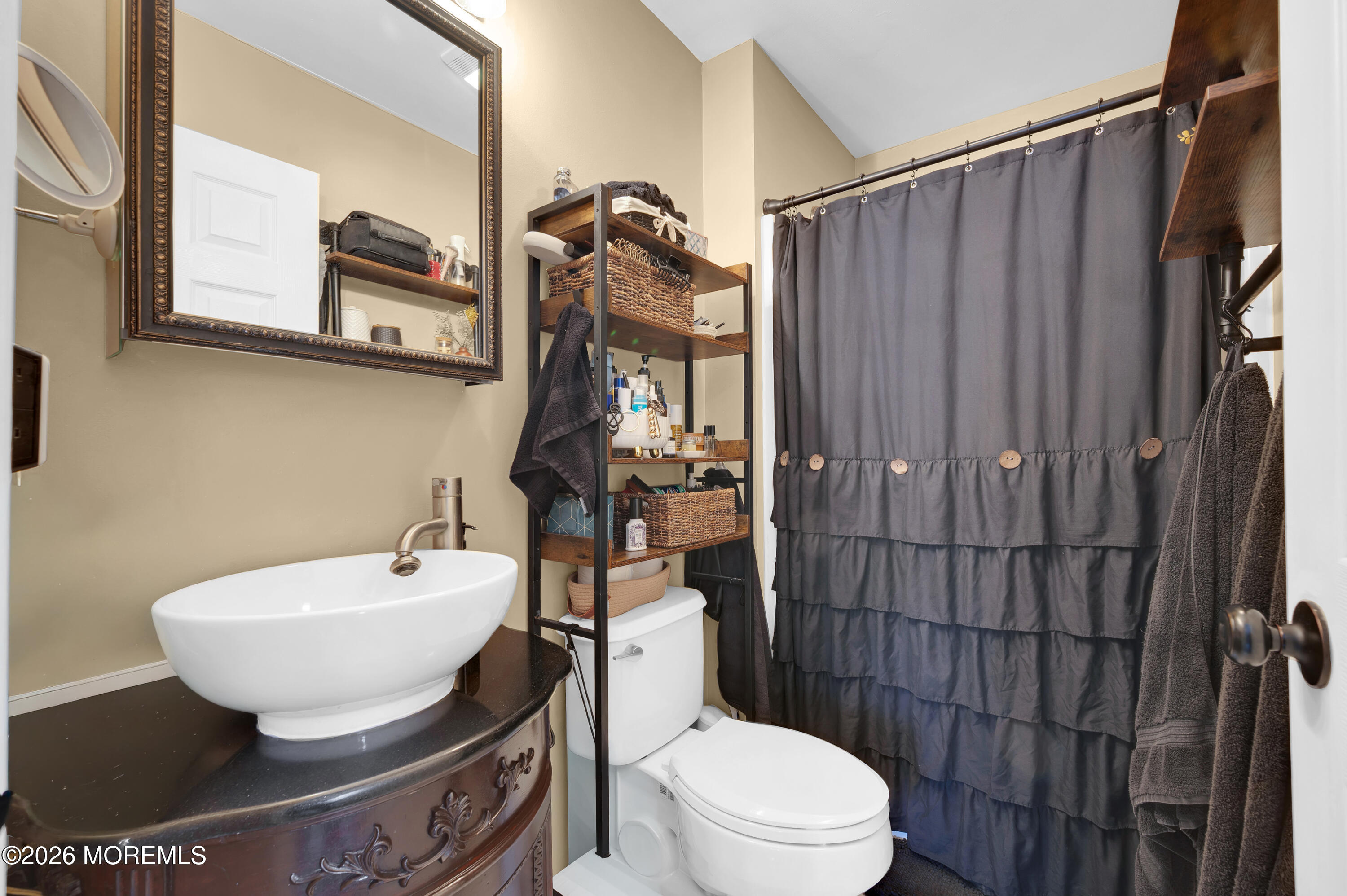 321 Letts Avenue Forked River, NJ 08731 - Photo 14 of 38 a bathroom with a toilet a sink and shower