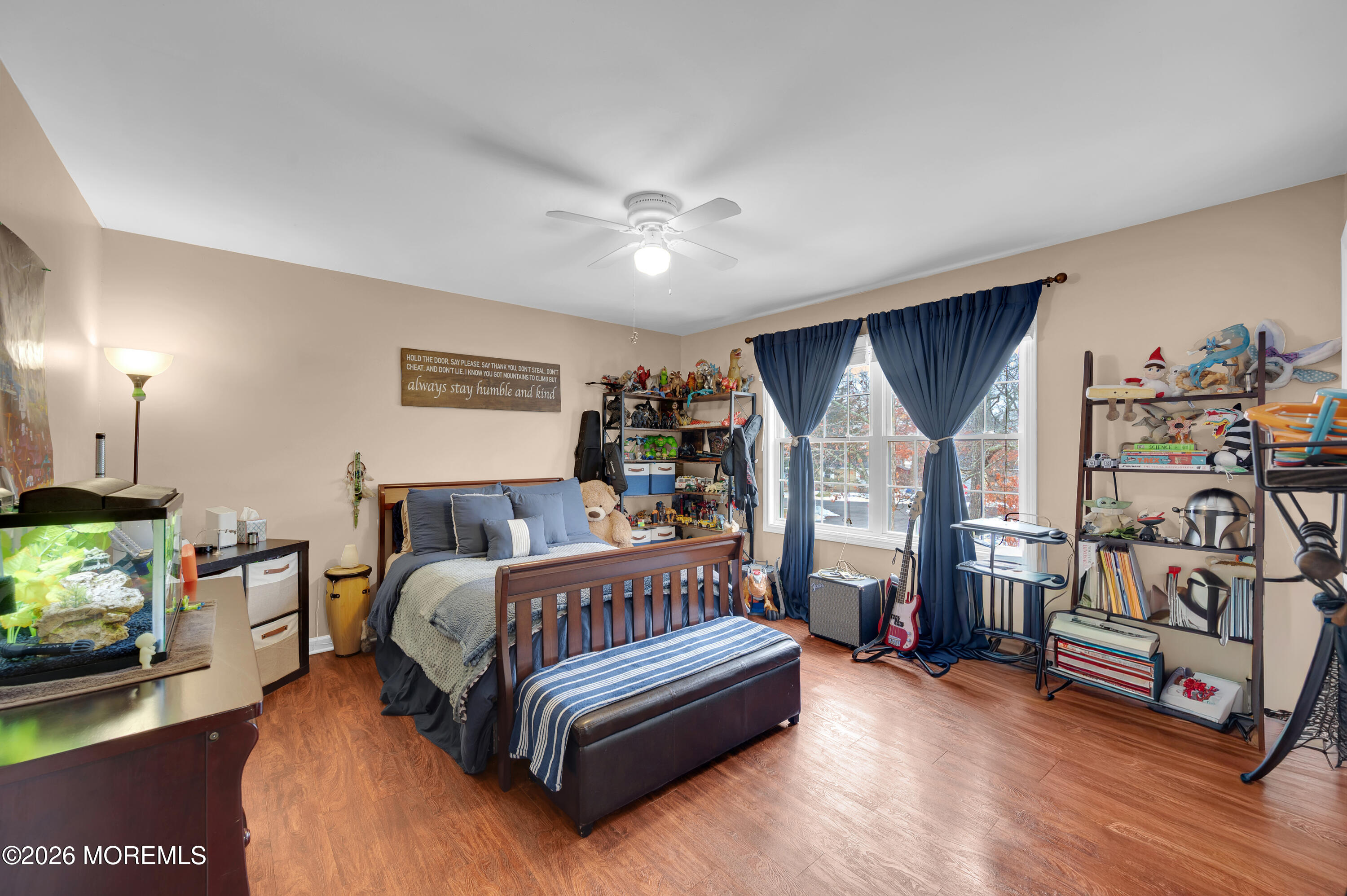 321 Letts Avenue Forked River, NJ 08731 - Photo 16 of 38 a bedroom with bed and a flat tv screen on dresser