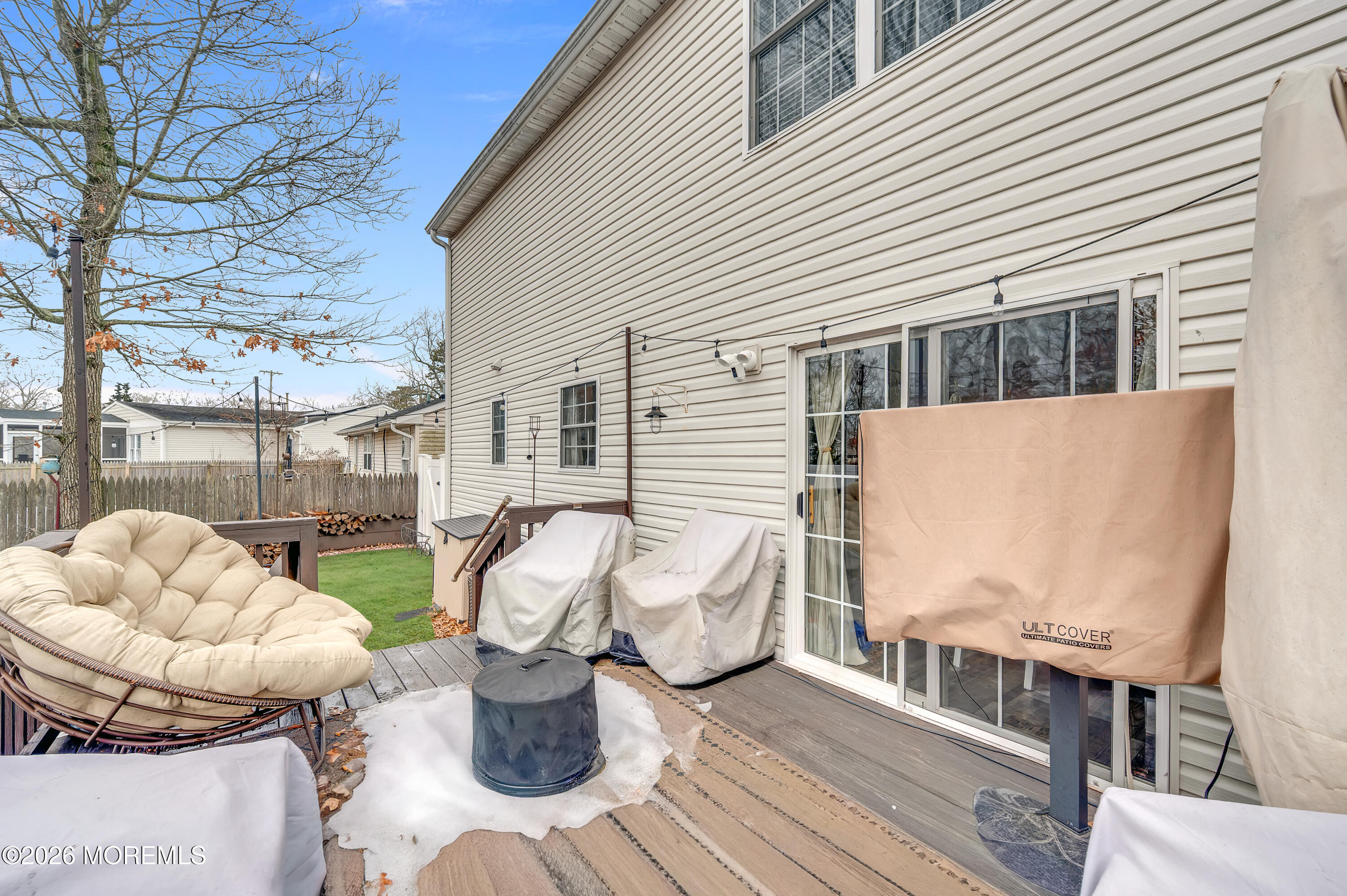 321 Letts Avenue Forked River, NJ 08731 - Photo 22 of 38 a view of a patio with couches chairs and wooden floor