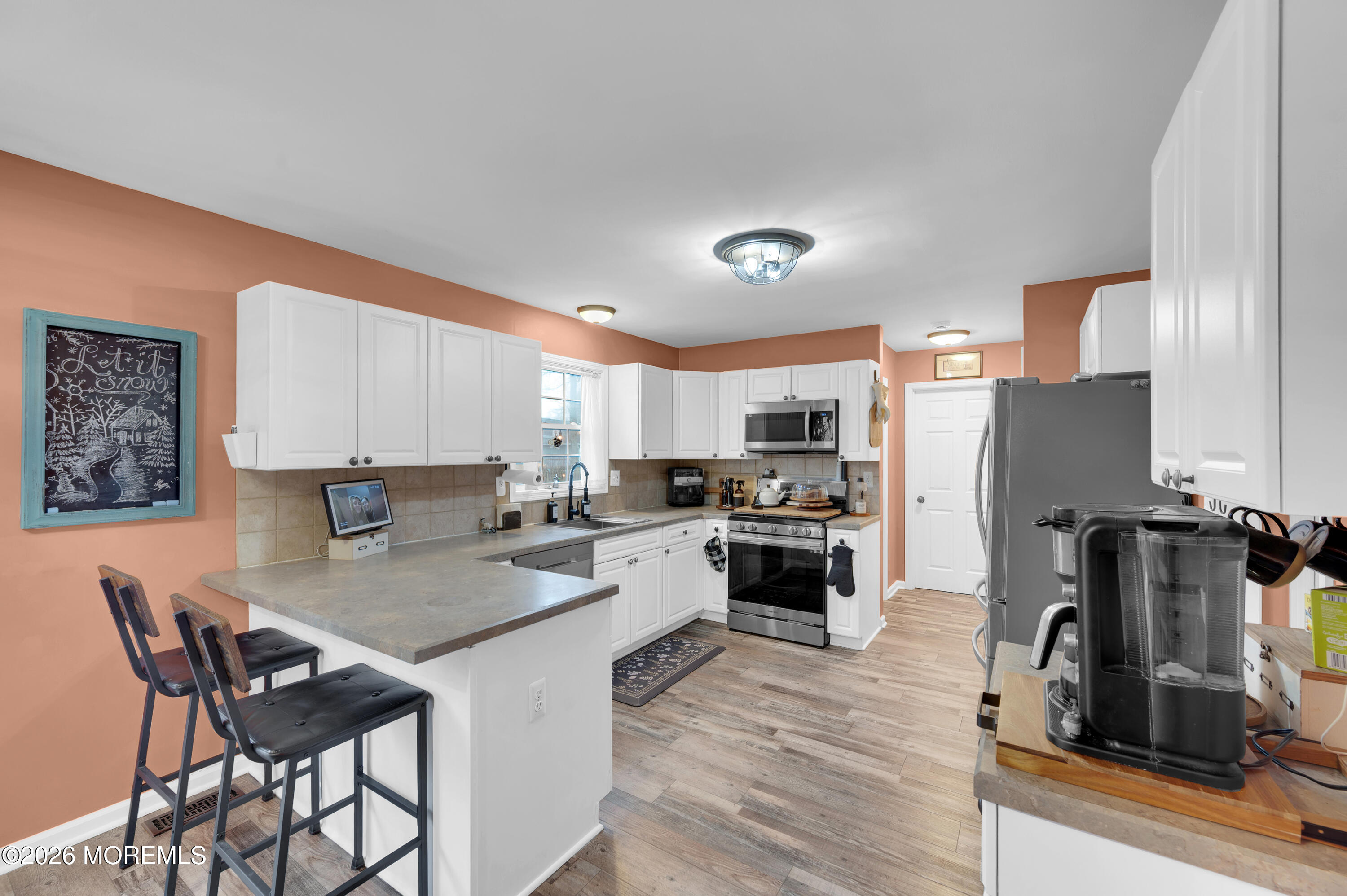 321 Letts Avenue Forked River, NJ 08731 - Photo 3 of 38 a kitchen with a table and chairs in it