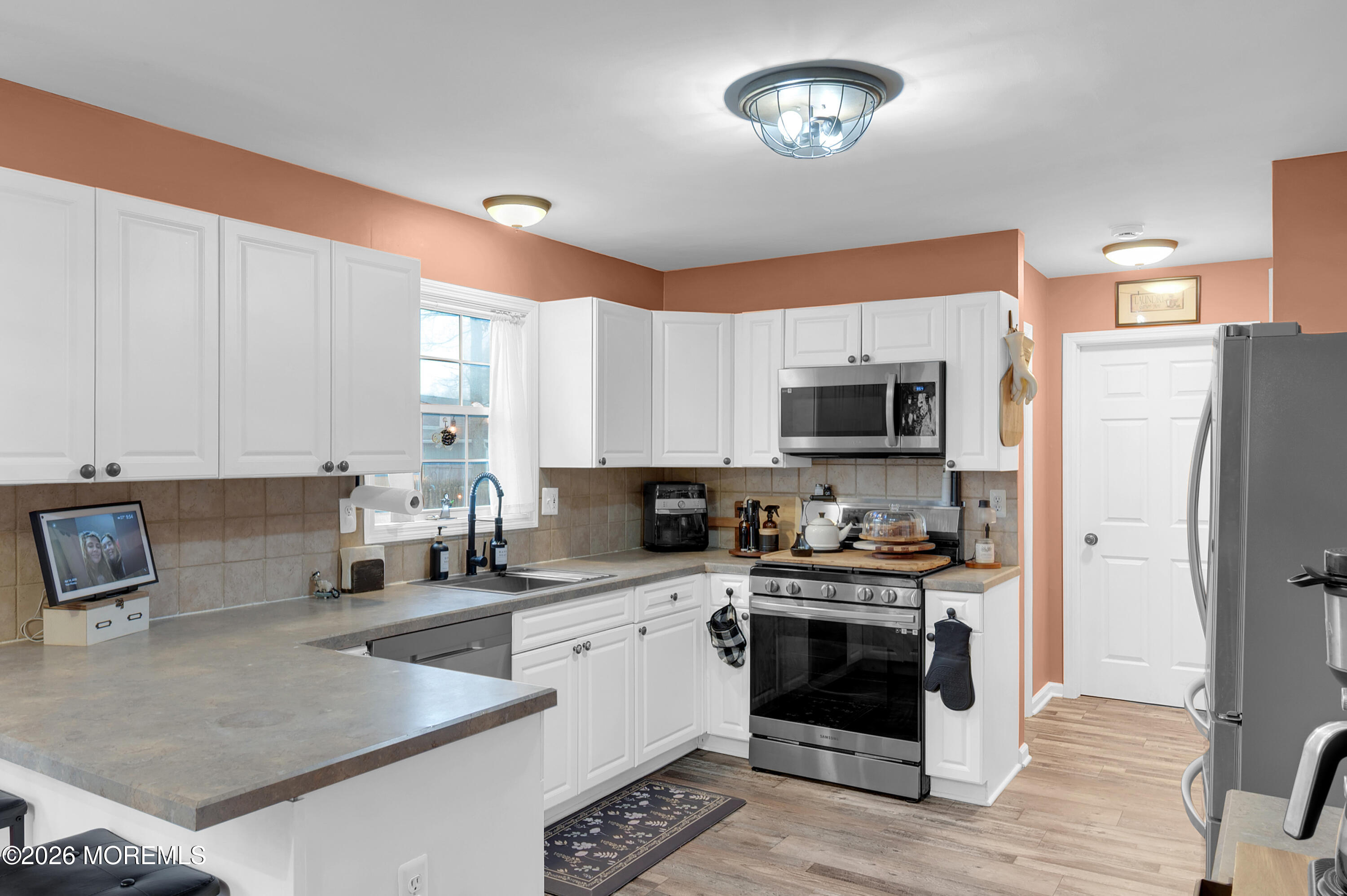 321 Letts Avenue Forked River, NJ 08731 - Photo 4 of 38 a kitchen with a stove a sink and a refrigerator