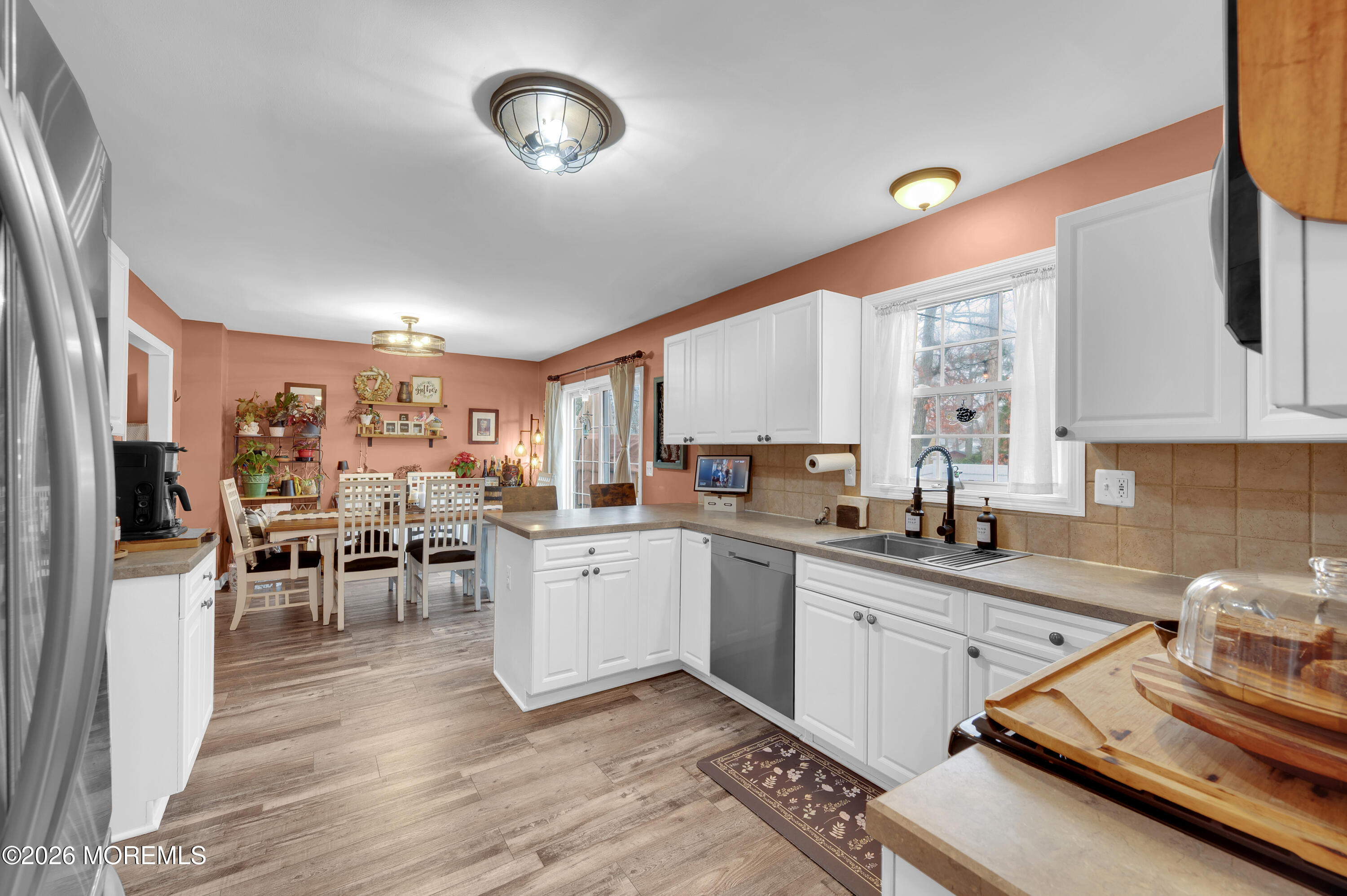 321 Letts Avenue Forked River, NJ 08731 - Photo 6 of 38 a kitchen with sink refrigerator and cabinets