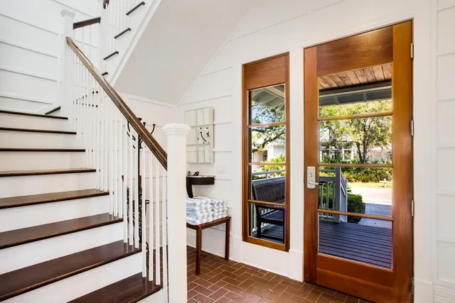 a view of entryway and hall with wooden floor